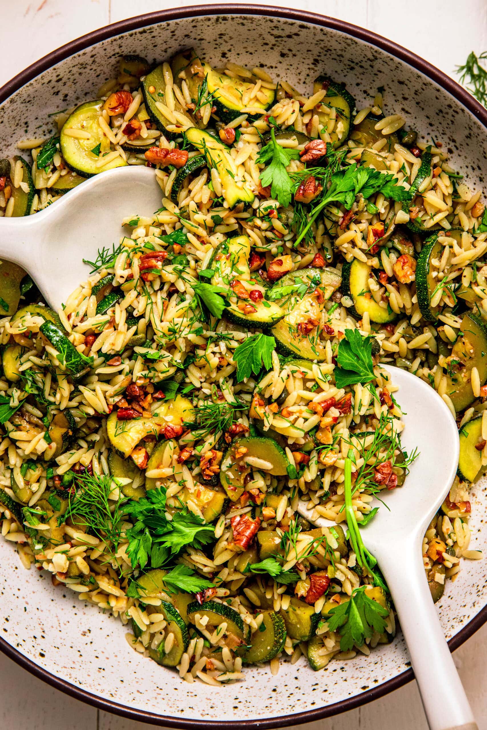 Overhead close up of bowl of zucchini orzo salad.